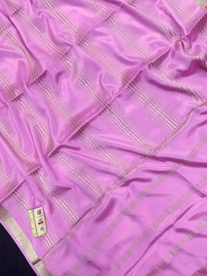 Woman wearing a Pure Mysore Silk Saree with smooth drape and zari border, perfect for weddings and traditional South Indian events.