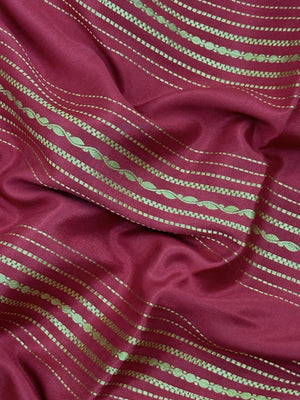 Woman wearing a Pure Mysore Silk Saree with smooth drape and zari border, perfect for weddings and traditional South Indian events.