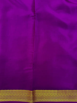 Woman wearing a Pure Mysore Silk Saree with smooth drape and zari border, perfect for weddings and traditional South Indian events.