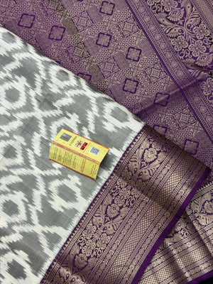 Woman draped in a Pure Pochampally Saree showcasing handwoven Ikat patterns in vibrant colors, representing traditional Telangana craftsmanship.
