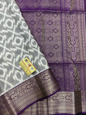 Woman draped in a Pure Pochampally Saree showcasing handwoven Ikat patterns in vibrant colors, representing traditional Telangana craftsmanship.