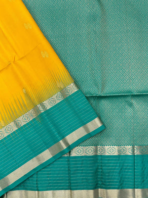 Woman wearing a Pure Silk Saree with glossy finish and intricate detailing, ideal for weddings and ethnic celebrations.