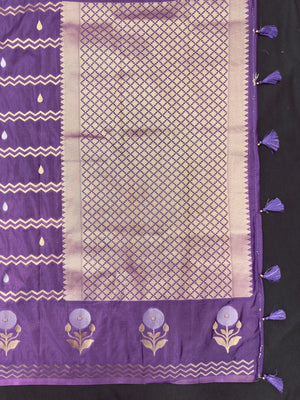 Woman wearing a Raw Mango Silk Saree with rich handloom texture and subtle sheen – perfect for weddings and festive occasions.