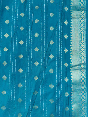 Woman wearing a Raw Mango Silk Saree with rich handloom texture and subtle sheen – perfect for weddings and festive occasions.