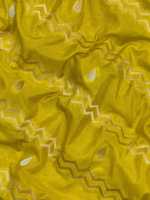 Woman wearing a Raw Mango Silk Saree with rich handloom texture and subtle sheen – perfect for weddings and festive occasions.