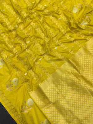 Woman wearing a Raw Mango Silk Saree with rich handloom texture and subtle sheen – perfect for weddings and festive occasions.