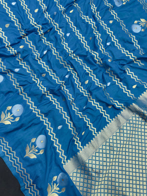 Woman wearing a Raw Mango Silk Saree with rich handloom texture and subtle sheen – perfect for weddings and festive occasions.