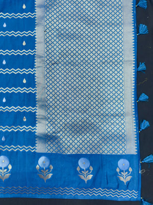 Woman wearing a Raw Mango Silk Saree with rich handloom texture and subtle sheen – perfect for weddings and festive occasions.