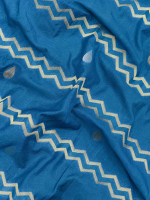 Woman wearing a Raw Mango Silk Saree with rich handloom texture and subtle sheen – perfect for weddings and festive occasions.