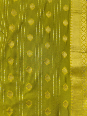 Woman wearing a Raw Mango Silk Saree with rich handloom texture and subtle sheen – perfect for weddings and festive occasions.