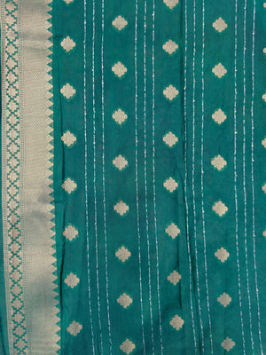 Woman wearing a Raw Mango Silk Saree with rich handloom texture and subtle sheen – perfect for weddings and festive occasions.