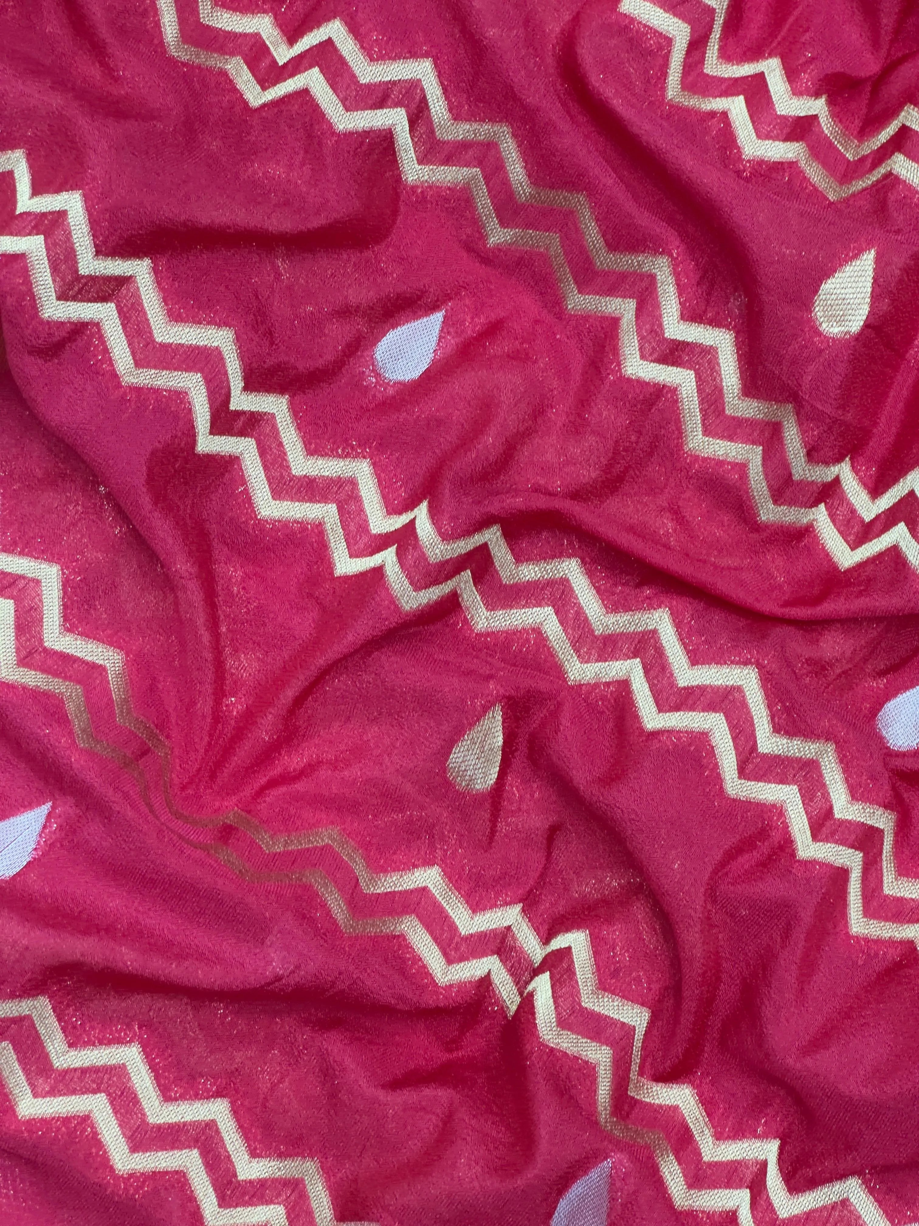 Woman wearing a Raw Mango Silk Saree with rich handloom texture and subtle sheen – perfect for weddings and festive occasions.