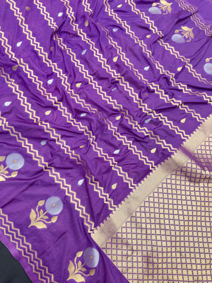 Woman wearing a Raw Mango Silk Saree with rich handloom texture and subtle sheen – perfect for weddings and festive occasions.