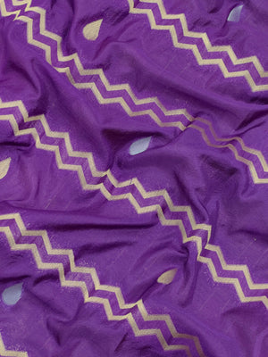 Woman wearing a Raw Mango Silk Saree with rich handloom texture and subtle sheen – perfect for weddings and festive occasions.