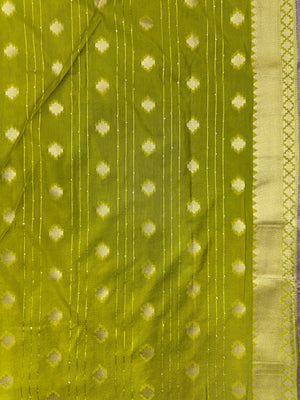 Woman wearing a Raw Mango Silk Saree with rich handloom texture and subtle sheen – perfect for weddings and festive occasions.