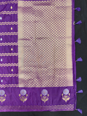 Woman wearing a Raw Mango Silk Saree with rich handloom texture and subtle sheen – perfect for weddings and festive occasions.