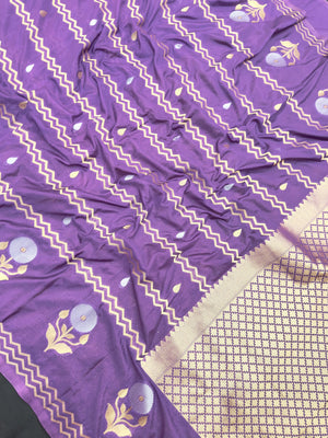 Woman wearing a Raw Mango Silk Saree with rich handloom texture and subtle sheen – perfect for weddings and festive occasions.