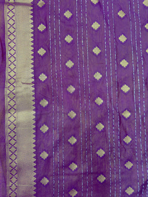 Woman wearing a Raw Mango Silk Saree with rich handloom texture and subtle sheen – perfect for weddings and festive occasions.