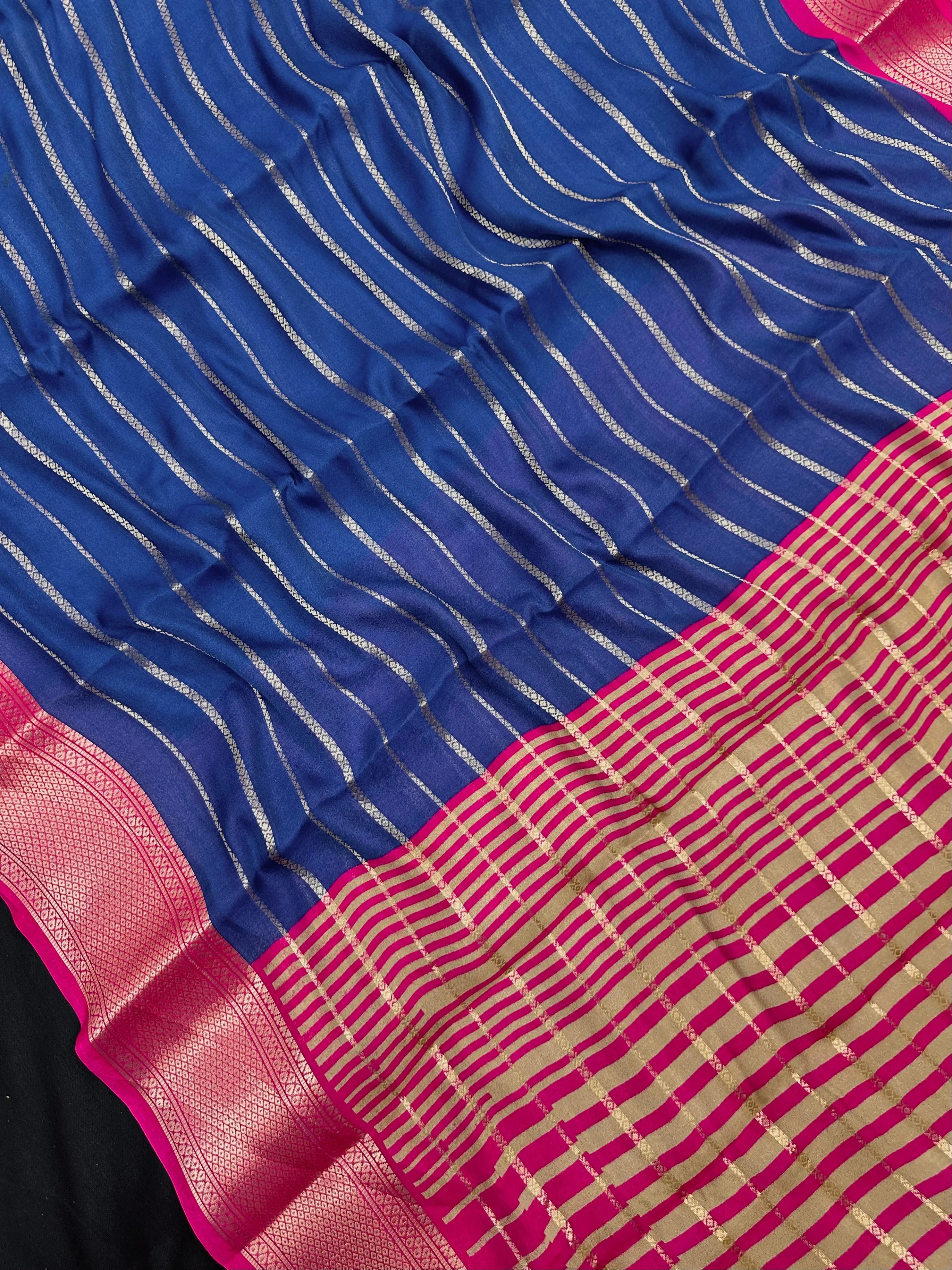 Woman draped in a Scarlet Chiffon Silk Saree with soft, flowing texture and elegant red hue, ideal for parties and festive occasions.