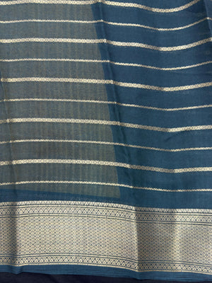 Woman draped in a Scarlet Chiffon Silk Saree with soft, flowing texture and elegant red hue, ideal for parties and festive occasions.