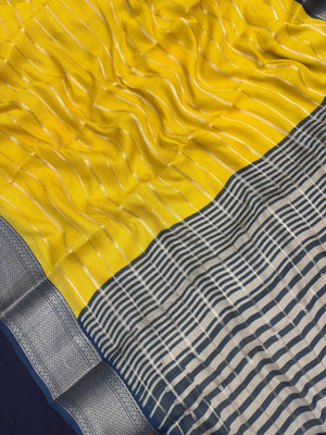 Woman draped in a Scarlet Chiffon Silk Saree with soft, flowing texture and elegant red hue, ideal for parties and festive occasions.