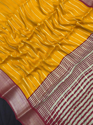 Woman draped in a Scarlet Chiffon Silk Saree with soft, flowing texture and elegant red hue, ideal for parties and festive occasions.