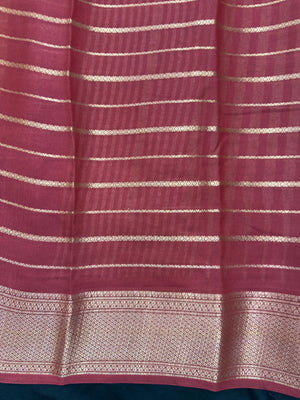 Woman draped in a Scarlet Chiffon Silk Saree with soft, flowing texture and elegant red hue, ideal for parties and festive occasions.