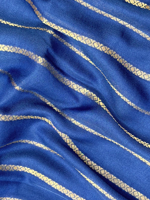 Woman draped in a Scarlet Chiffon Silk Saree with soft, flowing texture and elegant red hue, ideal for parties and festive occasions.