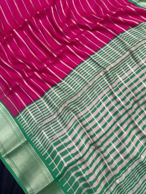 Woman draped in a Scarlet Chiffon Silk Saree with soft, flowing texture and elegant red hue, ideal for parties and festive occasions.