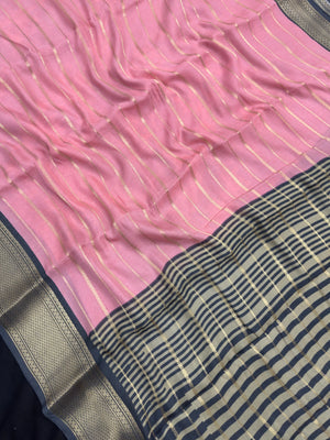 Woman draped in a Scarlet Chiffon Silk Saree with soft, flowing texture and elegant red hue, ideal for parties and festive occasions.