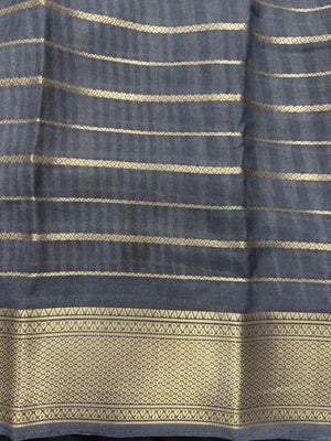 Woman draped in a Scarlet Chiffon Silk Saree with soft, flowing texture and elegant red hue, ideal for parties and festive occasions.