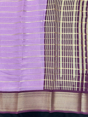 Woman draped in a Scarlet Chiffon Silk Saree with soft, flowing texture and elegant red hue, ideal for parties and festive occasions.