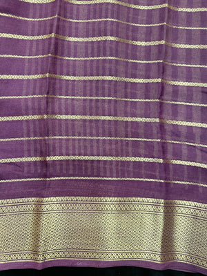 Woman draped in a Scarlet Chiffon Silk Saree with soft, flowing texture and elegant red hue, ideal for parties and festive occasions.