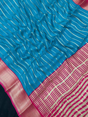 Woman draped in a Scarlet Chiffon Silk Saree with soft, flowing texture and elegant red hue, ideal for parties and festive occasions.