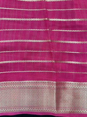 Woman draped in a Scarlet Chiffon Silk Saree with soft, flowing texture and elegant red hue, ideal for parties and festive occasions.