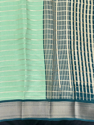 Woman draped in a Scarlet Chiffon Silk Saree with soft, flowing texture and elegant red hue, ideal for parties and festive occasions.