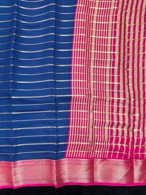 Woman draped in a Scarlet Chiffon Silk Saree with soft, flowing texture and elegant red hue, ideal for parties and festive occasions.