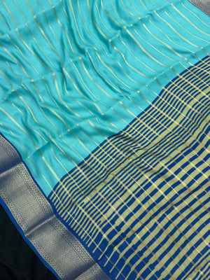 Woman draped in a Scarlet Chiffon Silk Saree with soft, flowing texture and elegant red hue, ideal for parties and festive occasions.