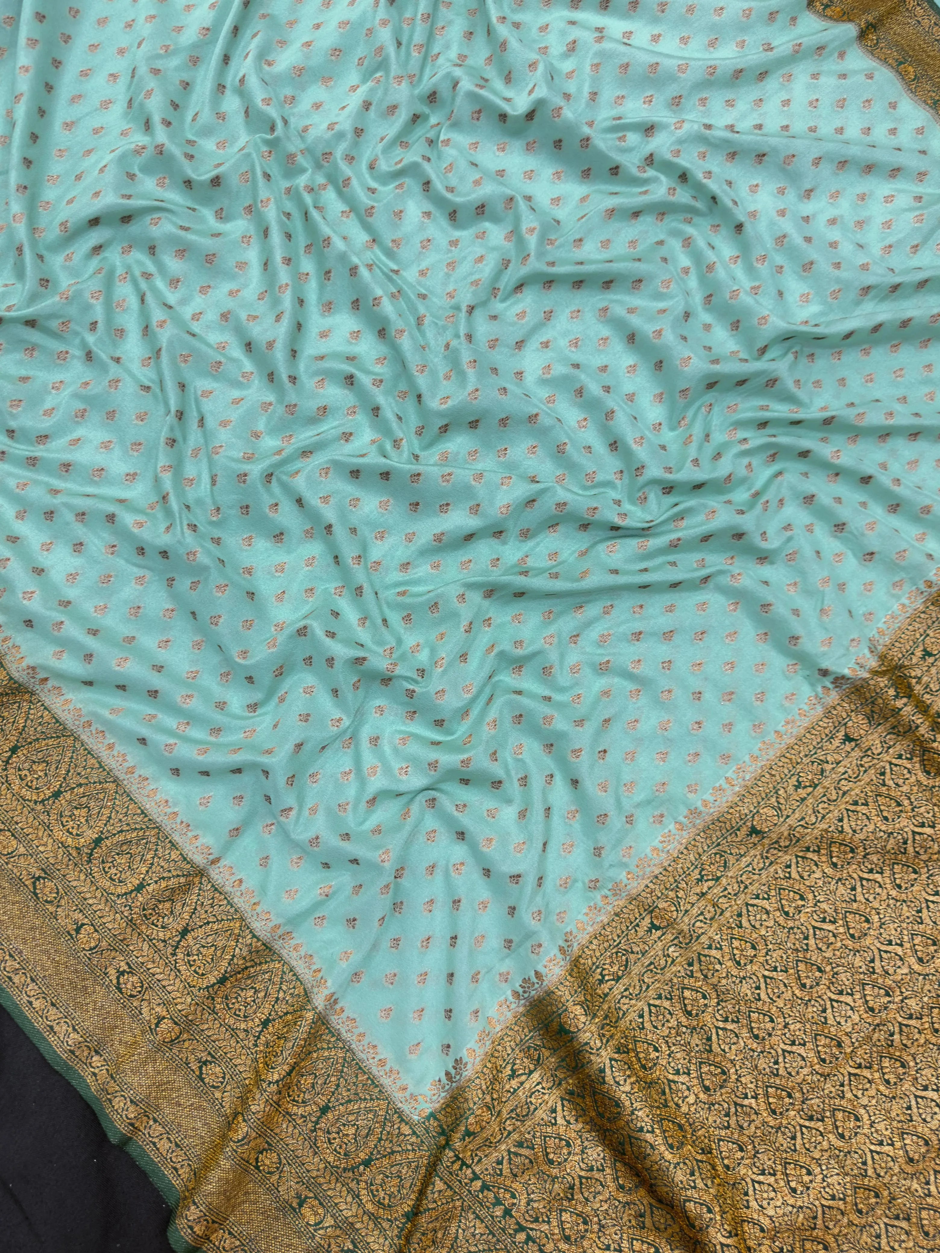 Woman in a Semi Banarasi Saree with golden zari motifs and rich pallu – lightweight and elegant for festive or daily ethnic wear.