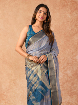Woman wearing a Semi Crepe Silk Saree with soft drape and subtle shine, ideal for office, family gatherings, and festive occasions.