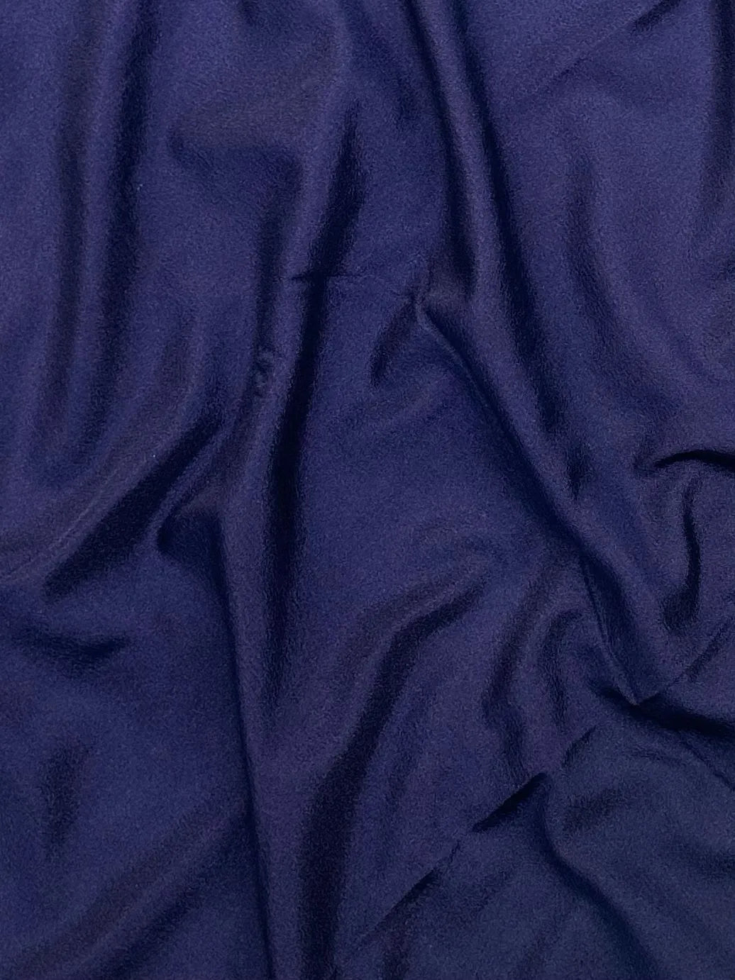 Woman draped in a Semi Crepe Silk Saree with soft texture and subtle shine, perfect for elegant office wear and festive occasions.