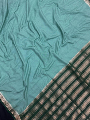 Woman draped in a Semi Crepe Silk Saree with soft texture and subtle shine, perfect for elegant office wear and festive occasions.