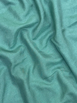 Woman draped in a Semi Crepe Silk Saree with soft texture and subtle shine, perfect for elegant office wear and festive occasions.