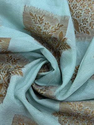 A beautifully draped Semi Banarasi Georgette Saree featuring intricate patterns and delicate weaving. The saree’s lightweight and breathable fabric ensures comfort, making it an ideal choice for daily wear. Perfectly blending traditional design with modern elegance, this saree is suitable for casual and formal occasions.