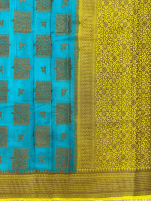 A beautifully draped Semi Banarasi Georgette Saree featuring intricate patterns and delicate weaving. The saree’s lightweight and breathable fabric ensures comfort, making it an ideal choice for daily wear. Perfectly blending traditional design with modern elegance, this saree is suitable for casual and formal occasions.