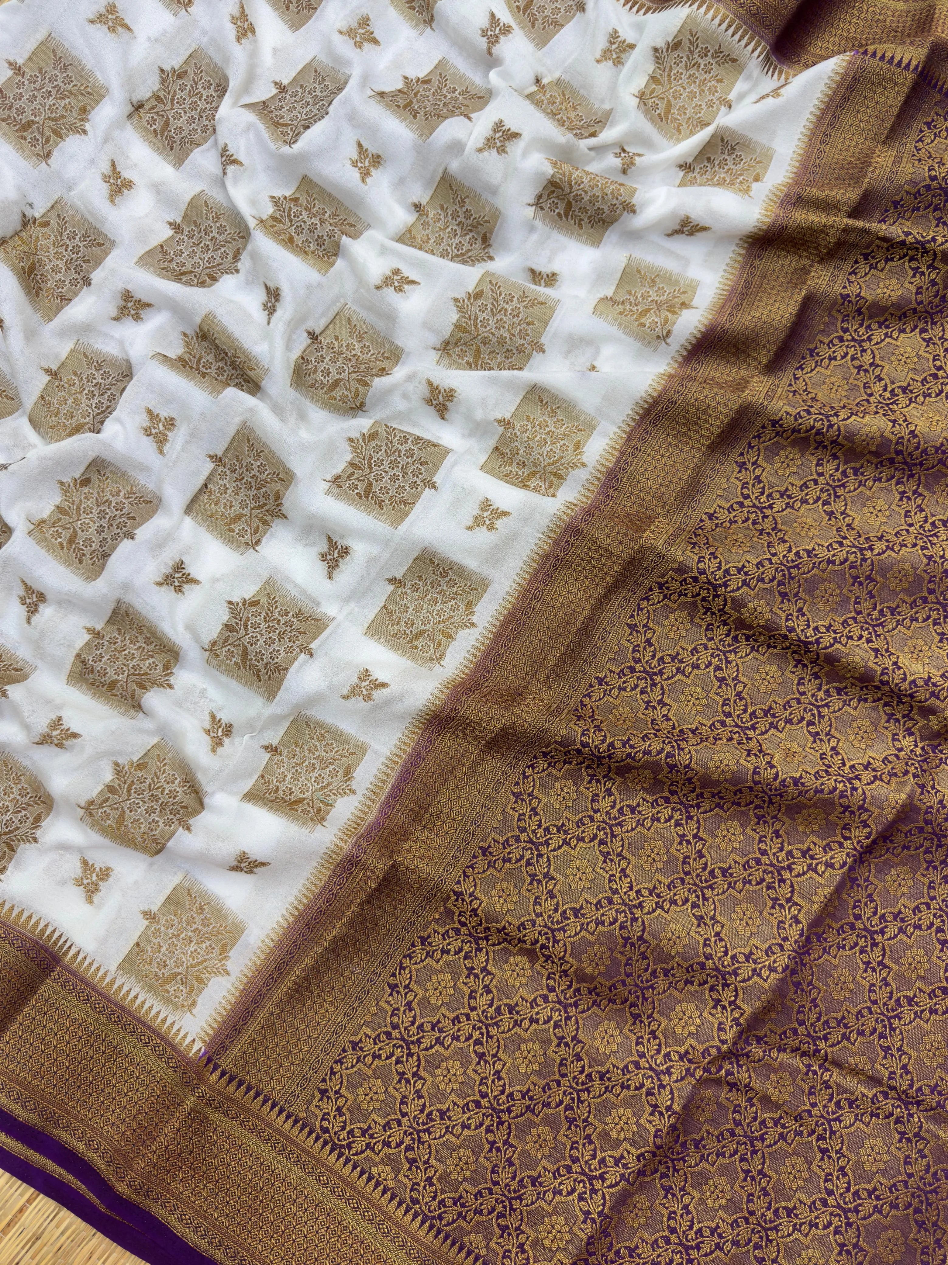 A beautifully draped Semi Banarasi Georgette Saree featuring intricate patterns and delicate weaving. The saree’s lightweight and breathable fabric ensures comfort, making it an ideal choice for daily wear. Perfectly blending traditional design with modern elegance, this saree is suitable for casual and formal occasions.