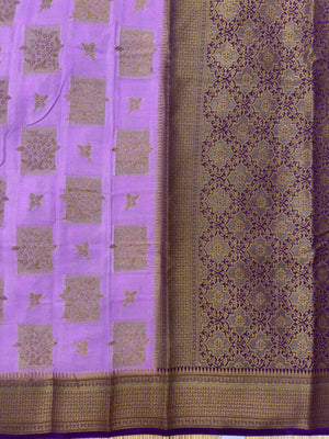A beautifully draped Semi Banarasi Georgette Saree featuring intricate patterns and delicate weaving. The saree’s lightweight and breathable fabric ensures comfort, making it an ideal choice for daily wear. Perfectly blending traditional design with modern elegance, this saree is suitable for casual and formal occasions.