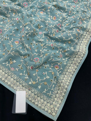 Woman wearing a Semi Georgette Silk Saree with a soft flowing drape and subtle shine, ideal for festive and formal occasions.