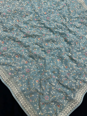 Woman wearing a Semi Georgette Silk Saree with a soft flowing drape and subtle shine, ideal for festive and formal occasions.