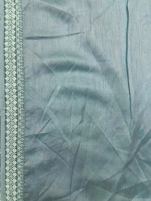 Woman wearing a Semi Georgette Silk Saree with a soft flowing drape and subtle shine, ideal for festive and formal occasions.